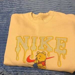 Nike Yellow Crewneck with Red Swoosh and Winnie the Pooh Graphic